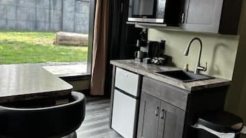 Microwave, coffee/tea maker, cookware/dishes/utensils, kitchen islands
