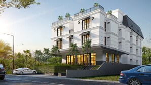 A modern building with a flat roof, large windows, and a balcony with palm trees. - Luxeur Jakarta - Setiabudi (Jakarta)