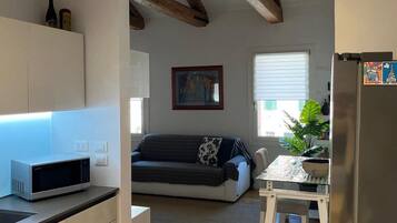 Comfort Apartment, Canal View | Living area | 50-inch Smart TV with digital channels
