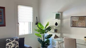 Comfort Apartment, Canal View | Living area | 50-inch Smart TV with digital channels