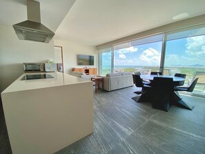Luxury Apartment, Balcony, Sea View | Living area | TV