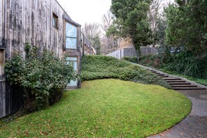 Stroll through the beautifully manicured lawn to the entrance of this charming property.