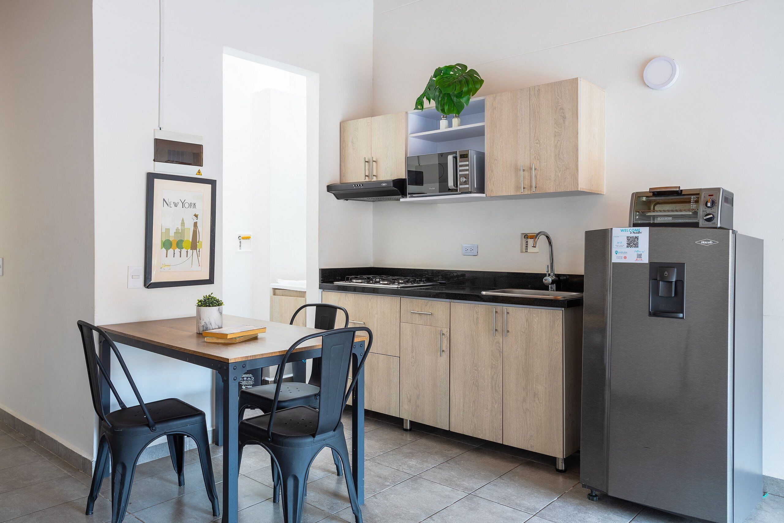 Fridge, microwave, coffee/tea maker, cookware/dishes/utensils