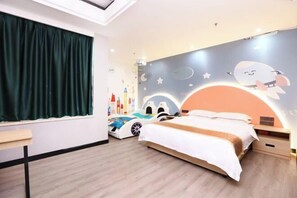 A bedroom with a bed, a desk, a window with curtains, and a wall with a space-themed mural. - Baohua Hotel (Chaozhou)