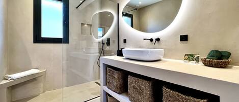Shower, hair dryer, towels, toilet paper