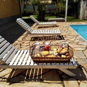 Outdoor pool, open 10:00 AM to 10:00 PM, sun loungers