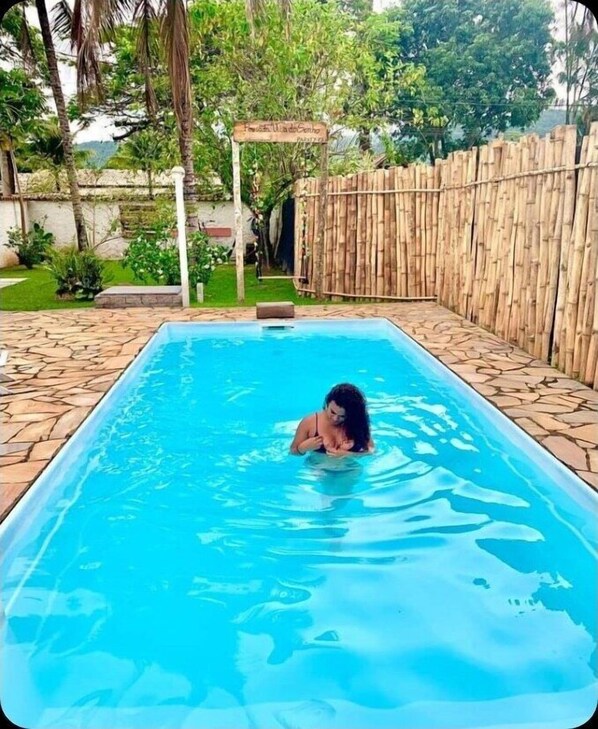 Outdoor pool, open 10:00 AM to 10:00 PM, pool loungers