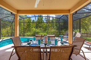 Outdoor dining - Luxury 4BR Retreat w/ Pool, Game Room & Close to Disney Attractions (Davenport)