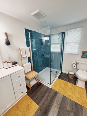 Shower, hair dryer, towels, soap