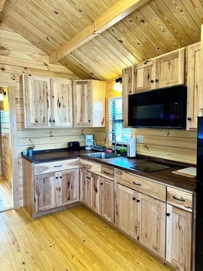 Fridge, microwave, cookware/dishes/utensils