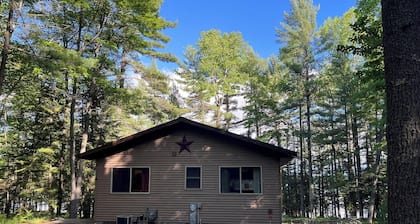 Beautiful 3 bed/2bath updated cabin w sandy swimmable frontage & great fishing.