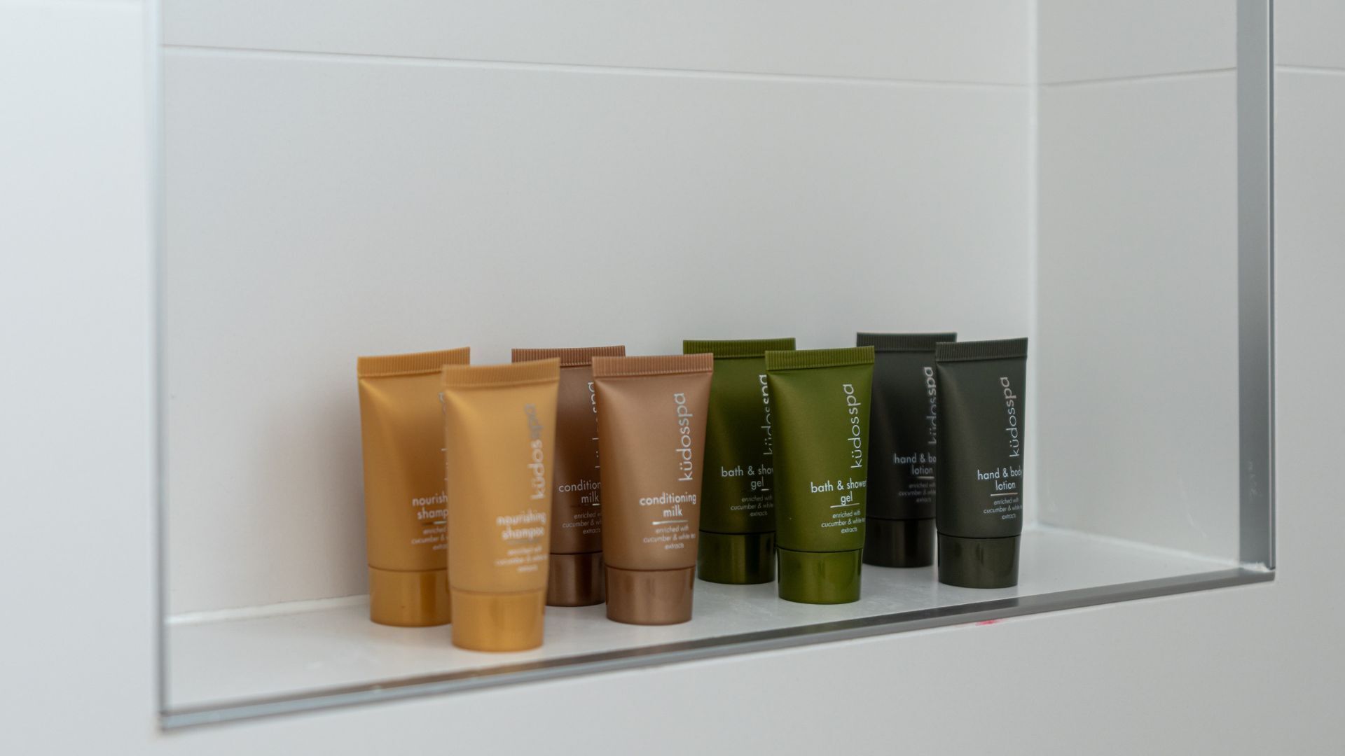 A shelf with various skincare products.