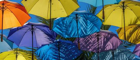 A collection of colorful umbrellas hanging overhead.