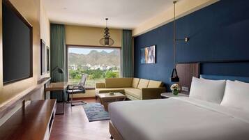 Desk, laptop workspace, blackout drapes, iron/ironing board