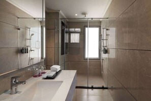 Junior Suite | Bathroom | Shower, slippers, towels - Ramada Encore By Wyndham Udaipur Roopnagar (Udaipur)