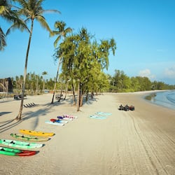On the beach, white sand, free beach cabanas, beach umbrellas