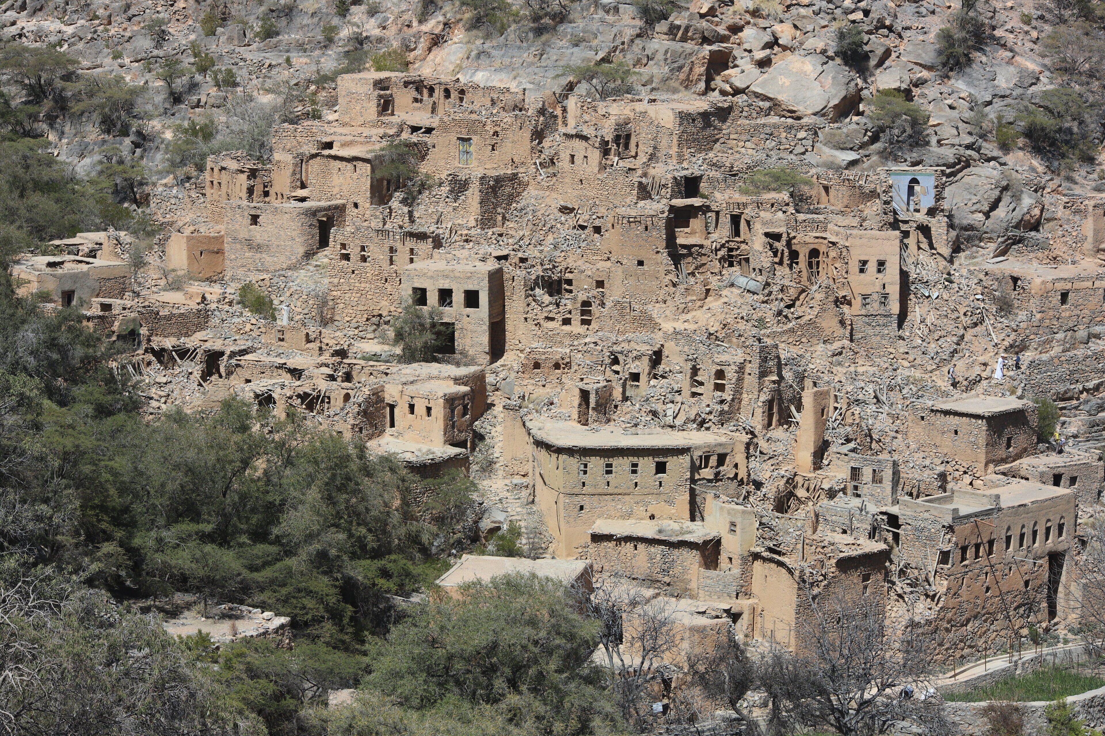 A rugged, mountainous village with traditional stone buildings.