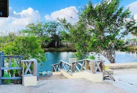 Property grounds. Lagoonfront 1BR Oasis Unit B – Gated, Private, 10 Min from Belize Airport & City