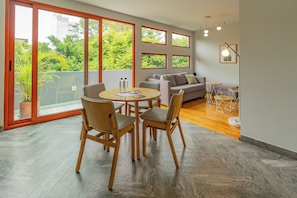 Deluxe Apartment | Living area | 50-inch flat-screen TV with satellite channels, TV