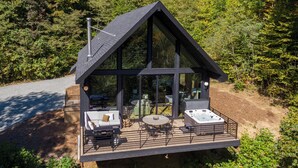 A modern cabin with a large deck, outdoor seating, and a hot tub. - Big Bear Escape (Banner Elk)