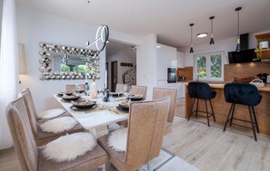 Enjoy meals in the well-lit kitchen with an oven and large window offering a view of the outdoors.