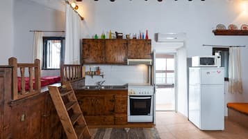 Fridge, microwave, stovetop, coffee/tea maker