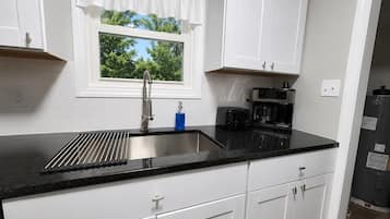 Coffee/tea maker, fridge, microwave, oven