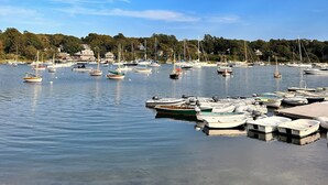 A marina with boats docked and a clear blue sky. - Charming Cape Cod summer house conveniently located  with plenty to offer. (Mashpee)
