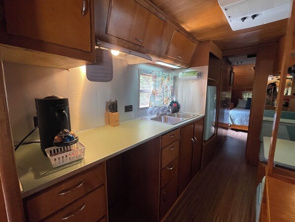 Interior - Vintage camper on the creek, short walk to pool and playground, deck, gas grill, sleeps 2. (Mill Spring)