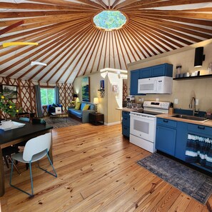 Living Area - Dog friendly 30' Yurt, large dome skylight, king bed, 2 bedrooms, sleeps 6. (Mill Spring)