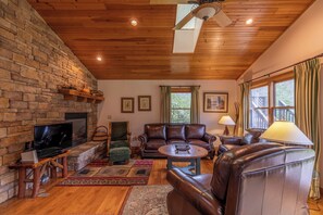 House, Multiple Beds, Hot Tub, Mountain View (Riverside Cabin) | Living area | Fireplace