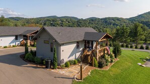 A two-story lodge with a porch and a view of a mountainous landscape. - Valley View (Banner Elk)
