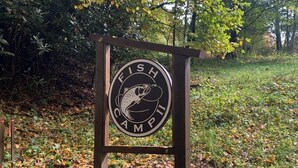 A sign with a fish and the words "FISH CAMP". - Bear Woods Belle at Eagles Nest (Banner Elk)