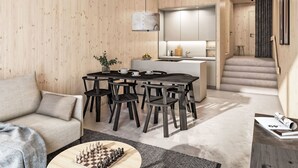 Un intérieur moderne comprenant un coin repas en bois, une cuisine et un escalier menant à un autre niveau.