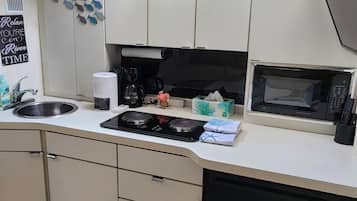 Fridge, microwave, stovetop, coffee/tea maker