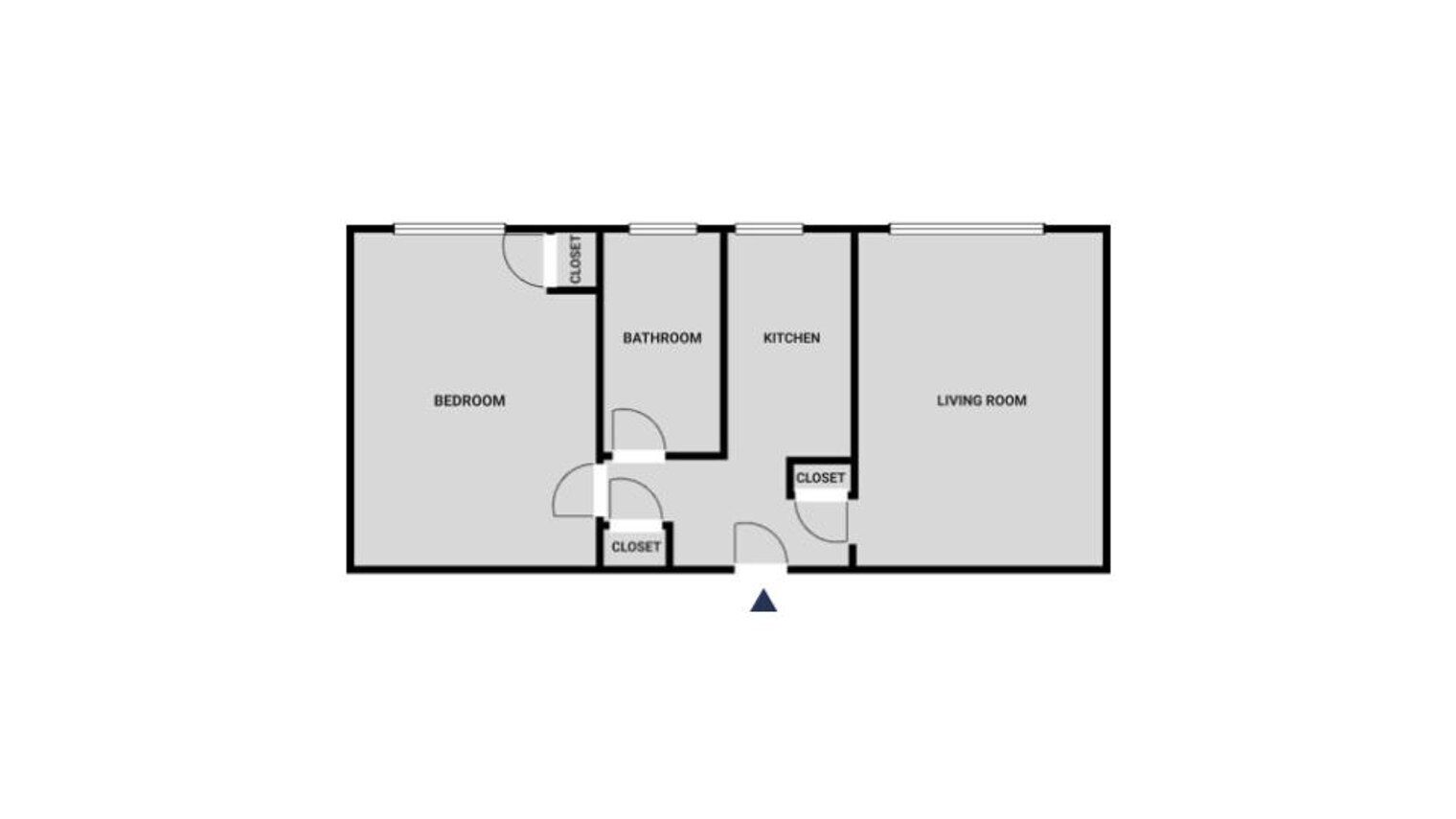 Un plan d’étage comprenant une chambre, une salle de bain, une cuisine et un salon, chacun étant doté d’un placard.