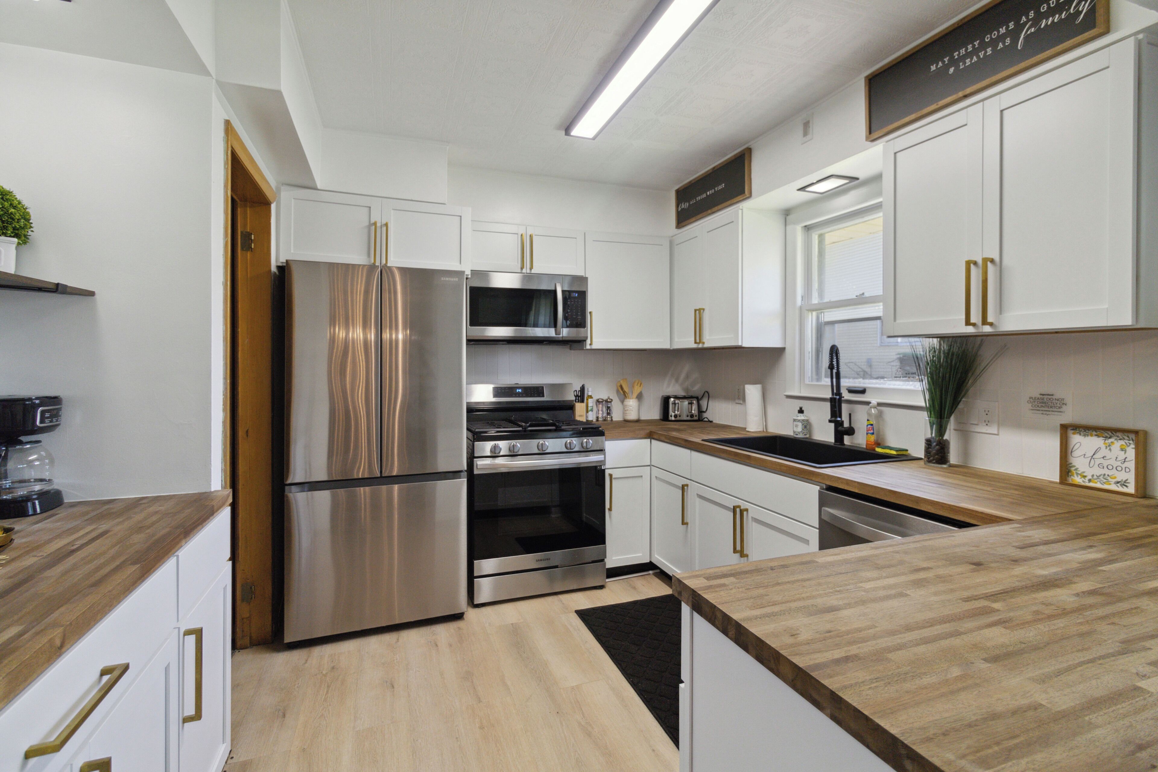 Fridge, microwave, electric kettle, cookware/dishes/utensils