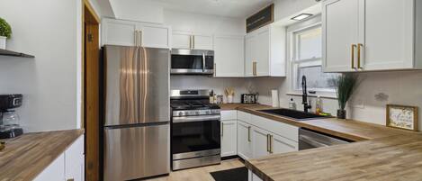 Fridge, microwave, electric kettle, cookware/dishes/utensils