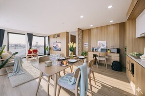 Deluxe Suite, Lake View | Living area | 52-inch flat-screen TV with cable channels - Label6 Coliving Quang Khanh (Hanoi)