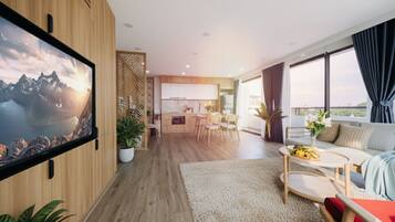 Deluxe Suite, Lake View | Living area | 52-inch flat-screen TV with cable channels