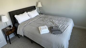 1 bedroom, desk, iron/ironing board, travel crib