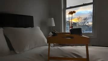 1 bedroom, desk, iron/ironing board, travel crib