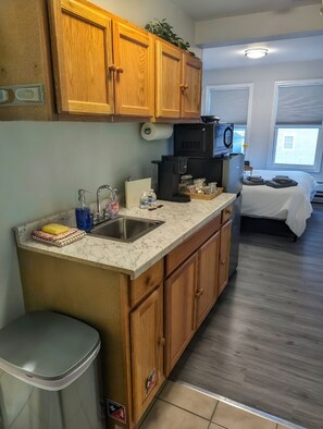 Microwave, coffee/tea maker, cookware/dishes/utensils, spices