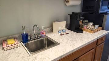 Microwave, coffee/tea maker, cookware/dishes/utensils, spices