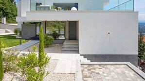 A modern two-story house with a flat roof, large glass windows, and a minimalist design. - Opatija Sky by Interhome (Opatija/Bregi)