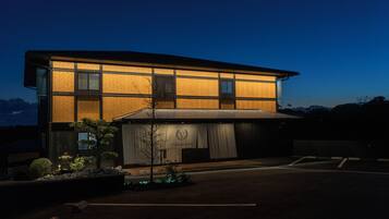 A modern building with a flat roof and large windows.