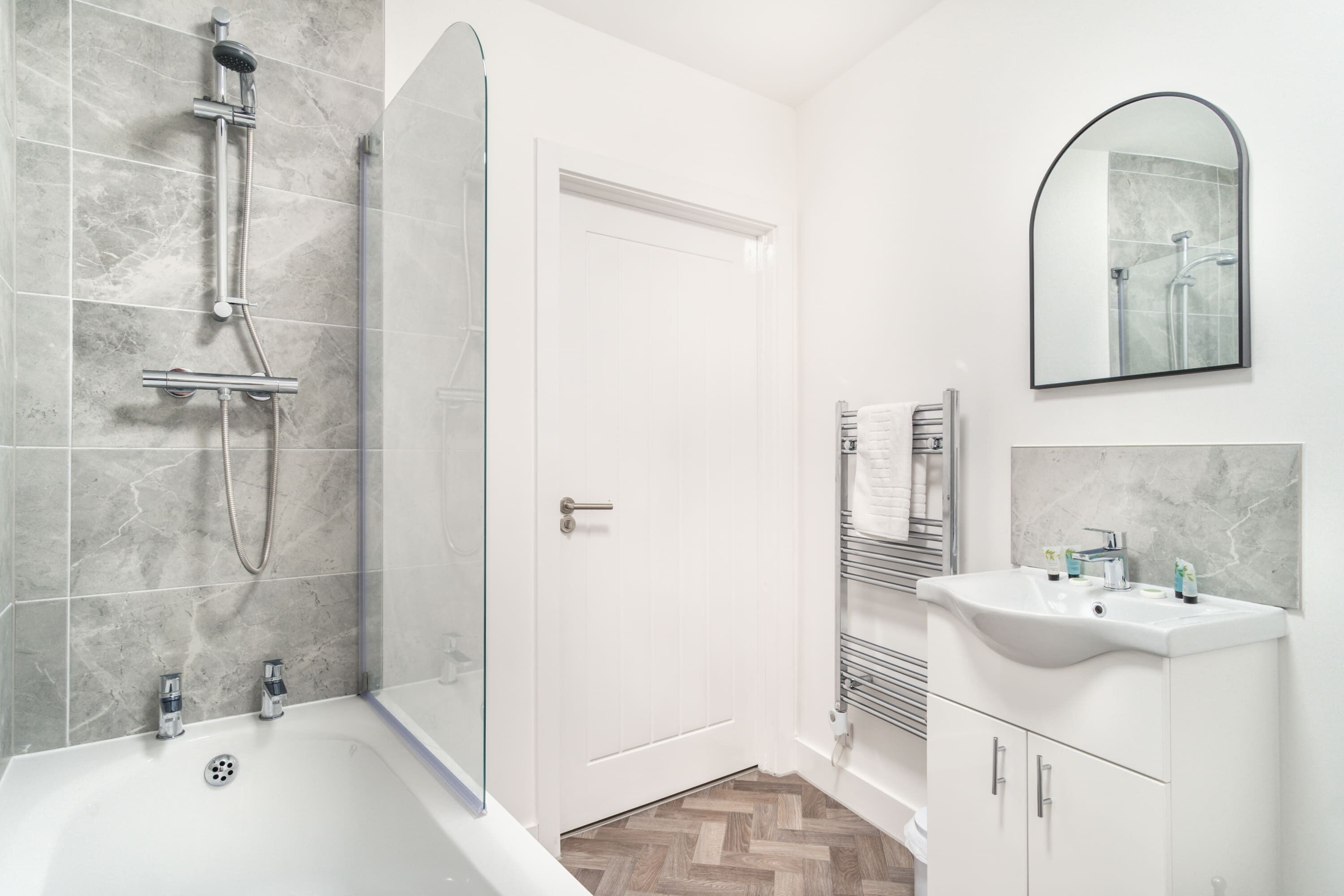 Shower, hair dryer, towels, shampoo