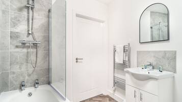 Shower, hair dryer, towels, shampoo