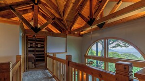 A wooden staircase leading to a balcony with a view of a mountainous landscape. - Mount Ever-Rest (Banner Elk)