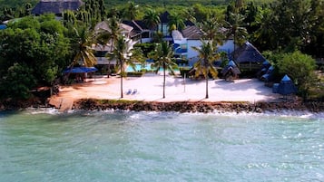 On the beach, white sand, free beach cabanas, beach shuttle